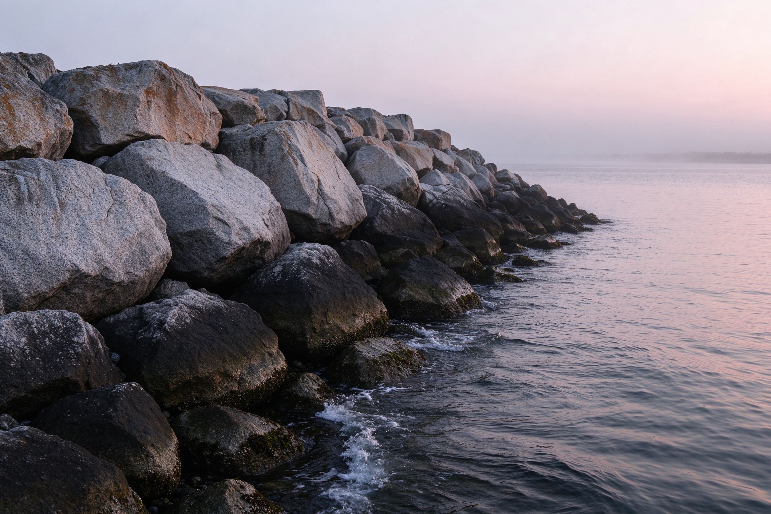 Granite breakwater at dawn